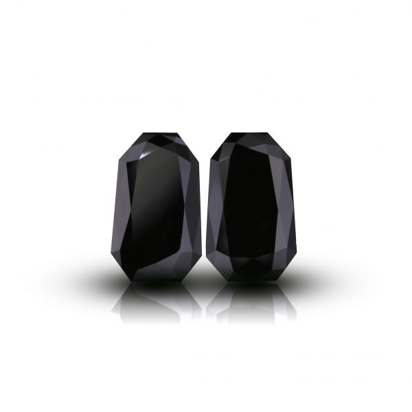 Matching Pair of Treated Black totalling 7.73 ct. Tapered radiant shape Diamond.