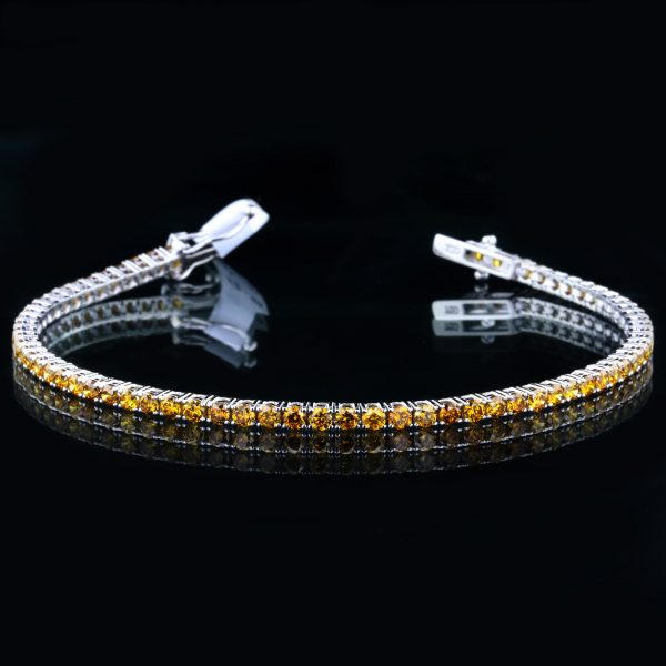 Tennis Bracelet With Natural Fancy Deep Orangy Yellow Diamond 18K White Gold